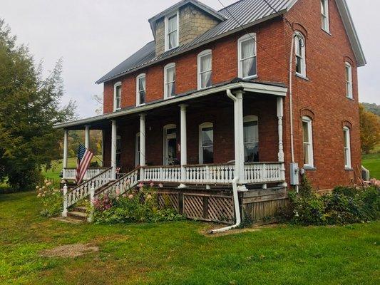 House is located along 2 lane road couple of miles outside of Confluence, PA