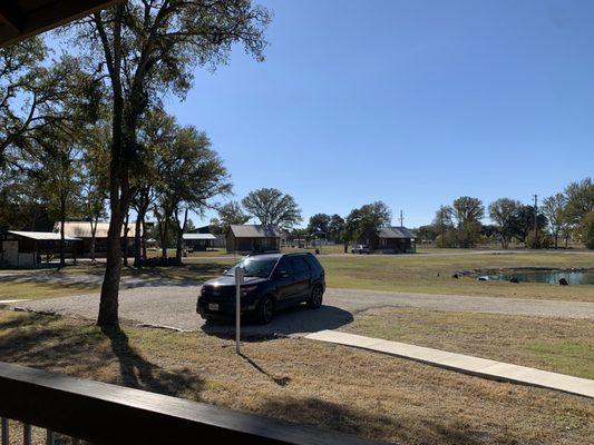 Front porch view from the Longhorn cottage #7 of nine total). Gate entrance is just to the right of my SUV in the background.