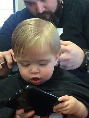 Matthew getting his very first haircut!