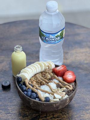 Açai bowl, lemon ginger shot and water