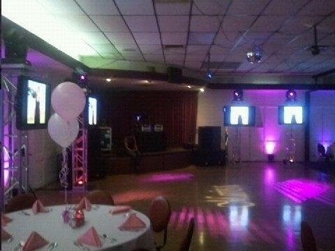 Our Video DJ setup with 4 flatscreens , uplighting, and a custom gobo