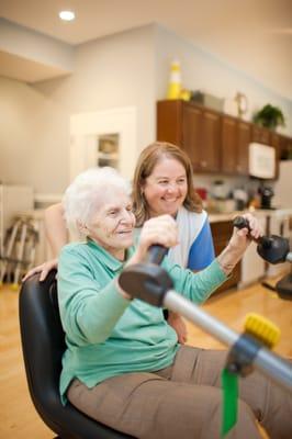 Physical Therapist Heather working with a patient on Upper Body Ergometer.