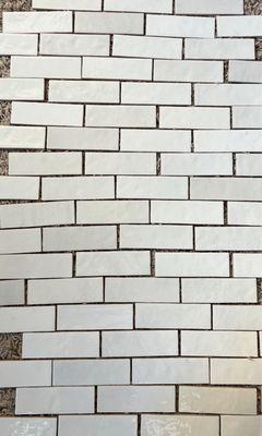 Actual tile has almost all white and very little variation.  Sent photo to them and told it looks great has tons of variation like sample.