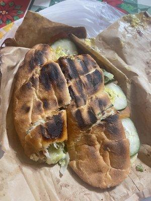 Burnt sandwich with the ingredients not even inside the sandwich