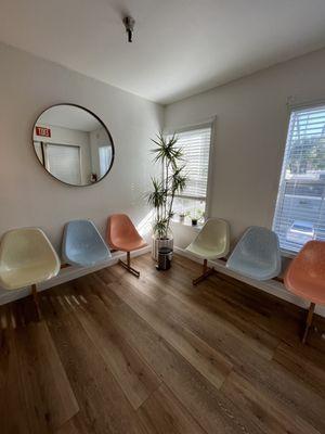 Seats in waiting room. Love these colors and the vibe she has in here.