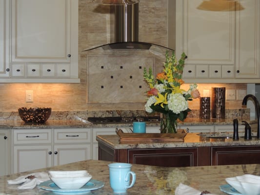 Esprit Decor Flooring can design and install your backsplash for you.