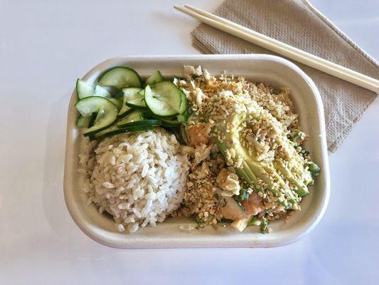 Small with brown rice, ahi tuna and salmon, lots of vegetables, avocado, crispy garlic and onions, double cucumber salad.