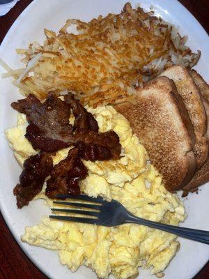 2 Eggs with 2 Bacon Breakfast  It comes with hasbrowns or Tator tots and your choice of bread or pancake