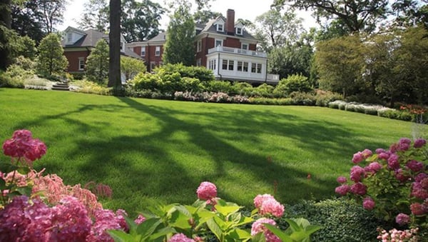 Alterations to a classic brick colonial home and integrated  into the landscape with precession.