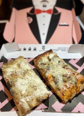 Cacio E Pepe and eggplant Parmigiana Slice (with the world's fanciest cardboard bib).