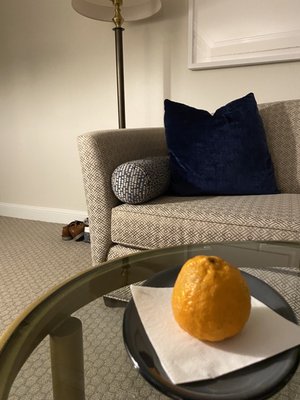 This orange welcomed us in the room.