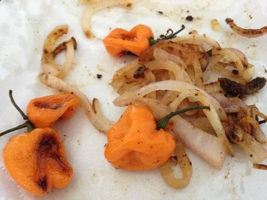 Grilled habanero peppers with onions