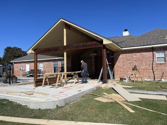 During an installation of an open gable wood porch.