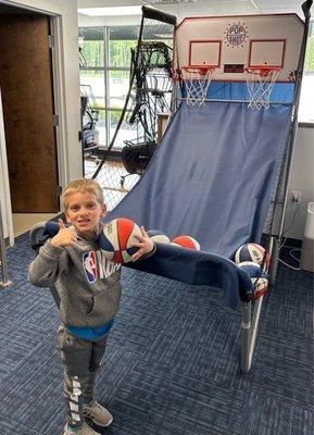 My son and me catching the ball via the basketball feeder excellent workout too and great for children to work on skillz