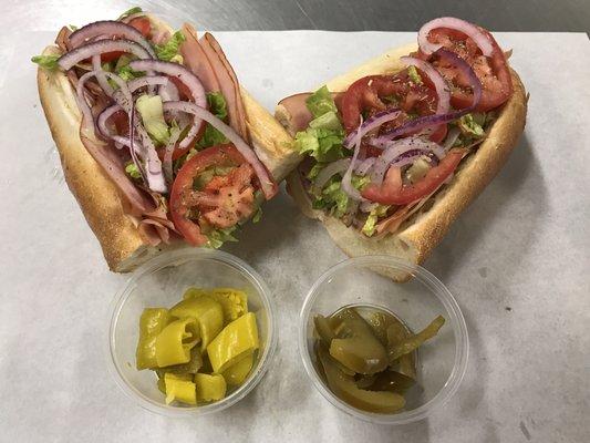 Italian Sub - 12 Inch: Honey Baked Ham, Genoa Salami, Provolone Cheese, Lettuce, Tomato, Onion, and House Made Italian Dressing.