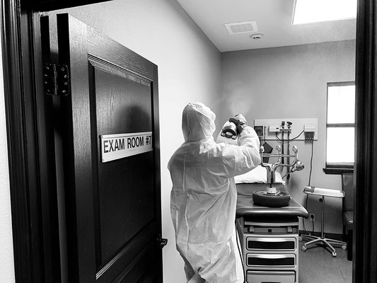 Special Cleaning doctor examining rooms during COVID-19