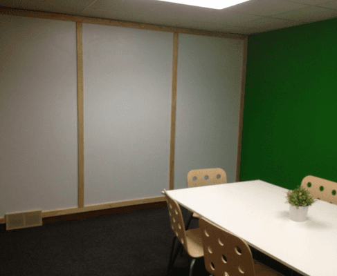 Our small conference room features a whiteboard wall and plenty of room for up to six to spread out.