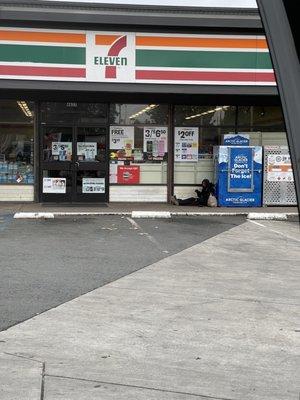 Guy smoking crack right in front of the store ....