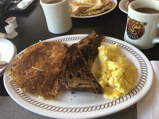 Hash browns, raisin toast with apple butter, bacon, scrambled eggs & bottomless coffee