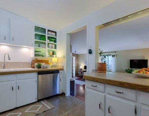 Updated light fixtures & fresh paint are just what this kitchen remodel needed to upgrade the prep space for cooking and entertaining!