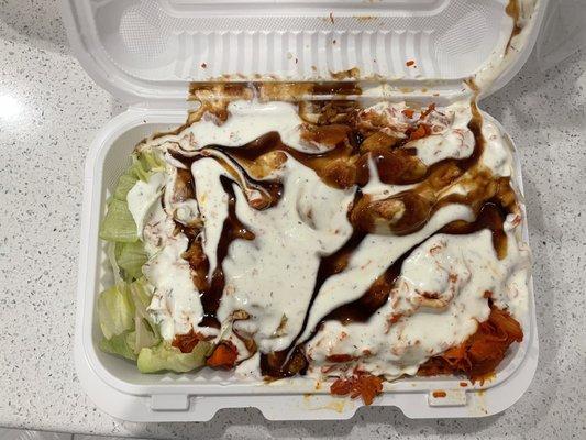 My go to: chicken over rice with bbq sauce and white sauce, $8