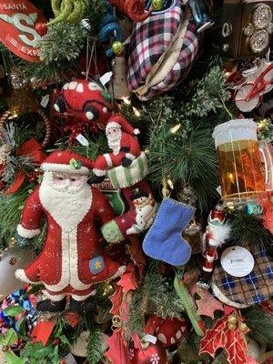 Santa and other ornaments on tree