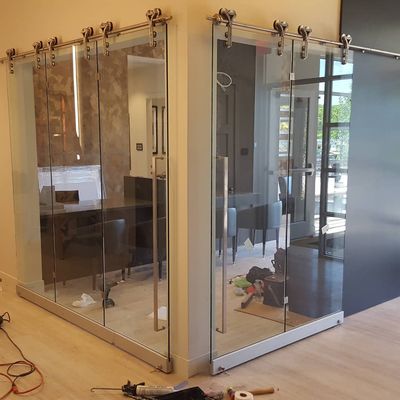 Sliding interior glass wall system