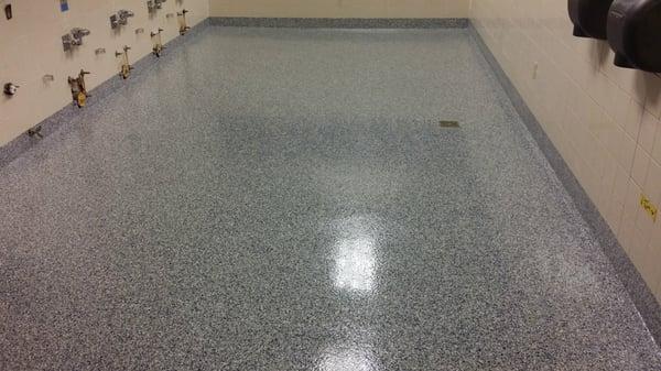 Decorative Flake Floor with Integrated Cove Base. The flakes are fully custom and can be a wide variety of colors.