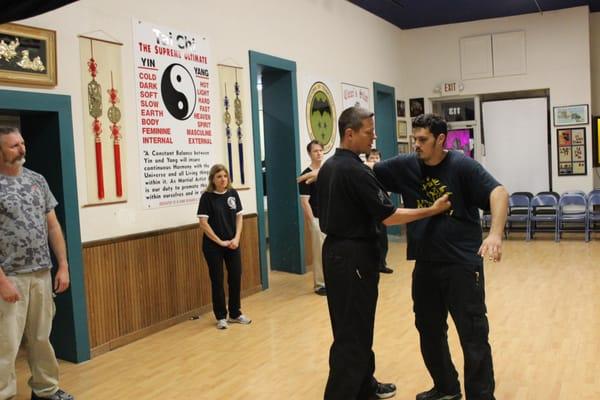 Here one of our students is learning how to absorb and shed the impact of a punch. It may look like he's getting hurt, but th...