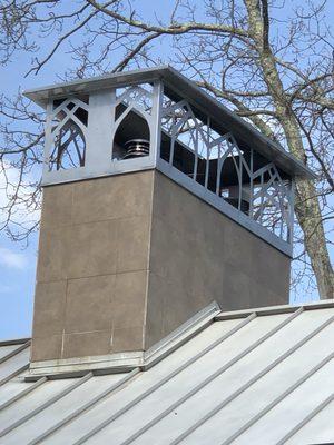 A chimney we recently serviced. Look at the beautifully made cap that houses four wood stoves in the home.