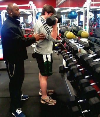 Personal trainer James Lewis with client.