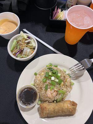 Entree of shrimp fried rice, egg roll, ginger dressing salad, & yum yum sauce.