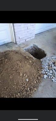 The hole in the driveway never taped off and blocking my garage for months!