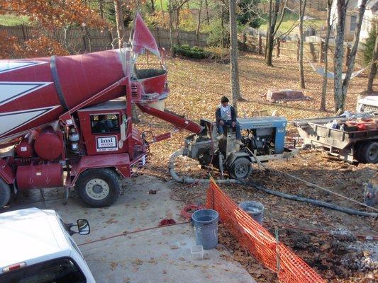 We use our custom blend of shotcrete from IMI Materials.