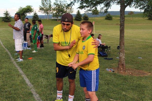 coach Oliver giving specific instruction to Nate on our first "KICK OFF" soccer tournament