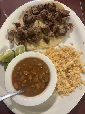 Lengua plate with charro beans and rice.