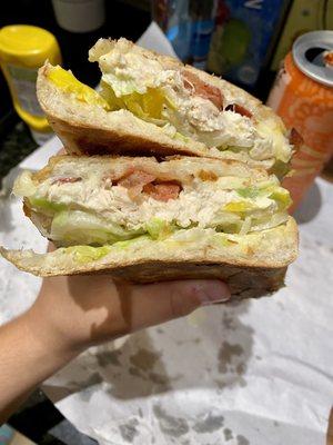 Chicken salad sandwich on Cuban bread, pressed. Lettuce, onions, bacon, provolone, banana peppers, and ranch!