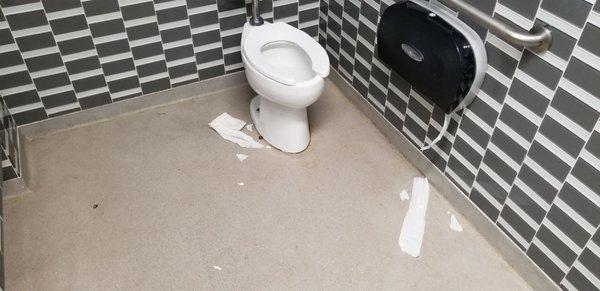 The men's restroom was disgusting. It looked like it hadn't been cleaned in days.