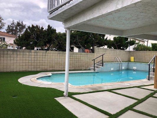 Back yard turf/cement/railing!