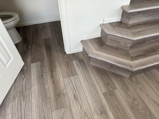 The original flooring is grey with no brown. The product that was laid is a brown grey.