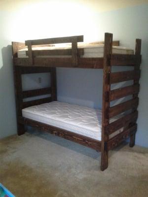 Twin/twin bunkbed with quality spring mattresses.