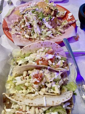 Carnitas tacos and chicken nachos