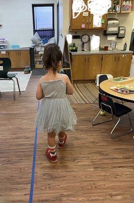 Pre-k classroom. Sensory tables, building toys, reading corner, pretend play area, art, music, she loved it here.