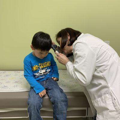 Dr. Gan Yong checking my boy's ears