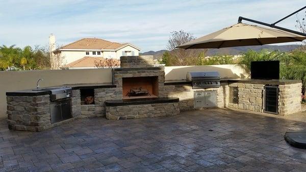 Beautiful built in BBQ With fireplace and outdoor kitchen,