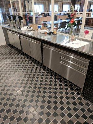 stainless cabinets with swing doors and drawers, and a counter top.