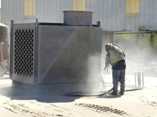 Sandblasting unit before applying primer.