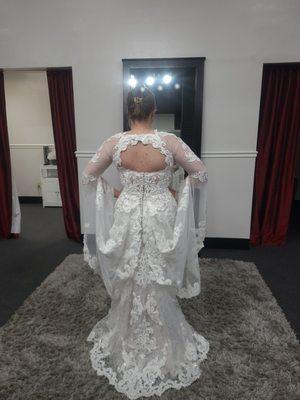 Custom sleeves and bustle option on a gown from enchanted bridal boutique