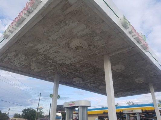 Before - gas station canopy deck very dirty and aged