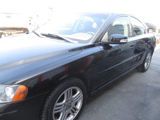 After repair: 2008 Volvo S60/ Replaced Left Front Door Skin, painted complete left side of vehicle.